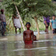 People wait to be rescued from a flooded village in Bihar.